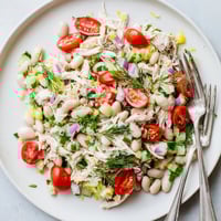 Fork-tender shredded chicken and creamy white beans mingle with crisp celery and fresh herbs in this vibrant Lemony White Bean Chicken Salad, glistening with citrusy vinaigrette.